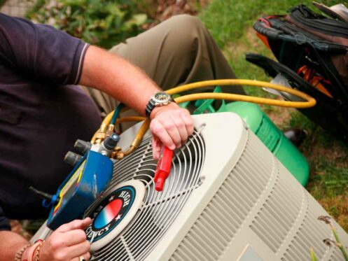 Air conditioner being serviced.