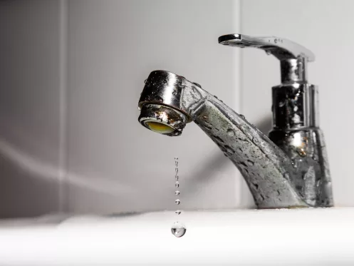 Faucet or tap and water drop pouring in bathroom .