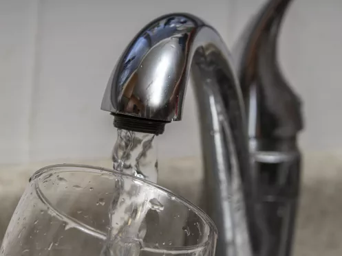 Glass at water tap and filling water with lead contamination