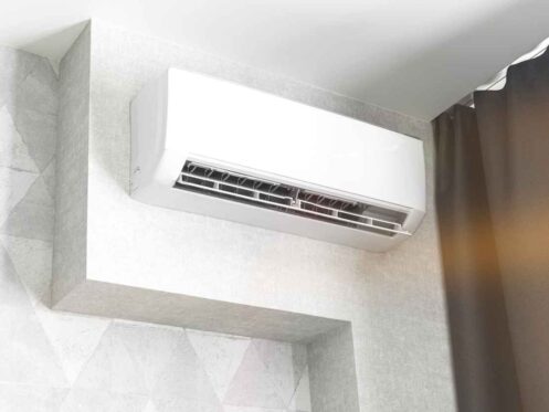 Ductless air conditioning system on white wall