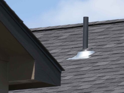 Duplex home rooftop ventilation pipe.